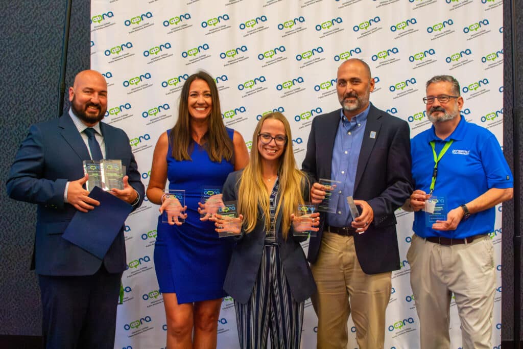 Image of group holding awards